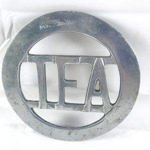 VTG Round Metal Hot Plate with the word TEA carved out 7.5 in diameter